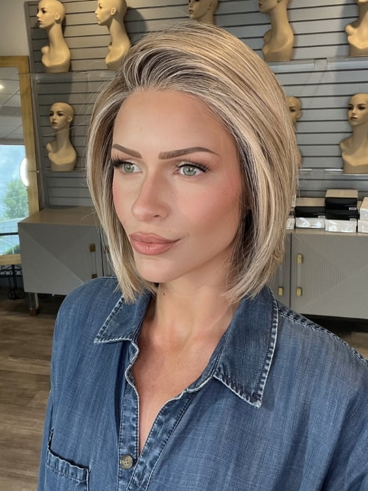 Madeline wearing BECKHAM by BELLETRESS in BUTTERCAKE BLONDE-R | A neutral-warm blonde blend featuring light brown, ash, and lightest blonde tones with natural-looking darker roots for added depth and realism.