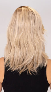Model is wearing DAZZLING WAVEZ by RENE OF PARIS in color MILKY OPAL R | A Blend of Creamy Blonde and White Blonde Rooted with Warm Brown