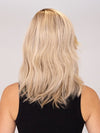 Model is wearing DAZZLING WAVEZ by RENE OF PARIS in color MILKY OPAL R | A Blend of Creamy Blonde and White Blonde Rooted with Warm Brown