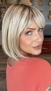Madeline is wearing SING by ELLEN WILLE in PEARL BLONDE ROOTED 101.20.25 | Pearl Platinum Blended with Light Strawberry Blonde and Lightest Golden Blonde with Shaded Roots