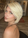 Madeline is wearing SMOOTH CUT BOB by TRESSALLURE in 24/102/R12 | Gold Blonde with Platinum Highlights with Gold Brown Roots
