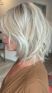 Madeline wearing EMILIA by BELLETRESS in BUTTERBEER R | Dark Brown Base and Root that transitions smoothly into a buttery blonde, infused with creamy honey and toffee tones
