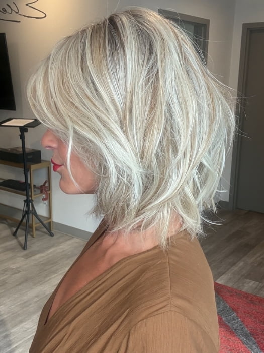 Madeline wearing EMILIA by BELLETRESS in BUTTERBEER R | Dark Brown Base and Root that transitions smoothly into a buttery blonde, infused with creamy honey and toffee tones