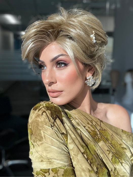 ROXIE wearing CAPTIVATING CANVAS by RAQUEL WELCH in RL13/88 Golden Pecan | Neutral Medium Blonde With Pale Honey Blonde Highlights