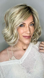 Kristyna Moore @kristynamoore wearing DIRECTORS PICK by RAQUEL WELCH WIGS in color RL19/23SS SHADED BISCUIT | Light Ash Blonde Evenly Blended with Cool Platinum Blonde with Dark Roots (inside lighting)