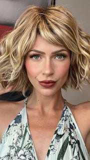 Madeline wearing TREND by TRESSALLURE in 14/26/R10 | Red Blonde with Gold Blonde Highlights and Light Brown Roots