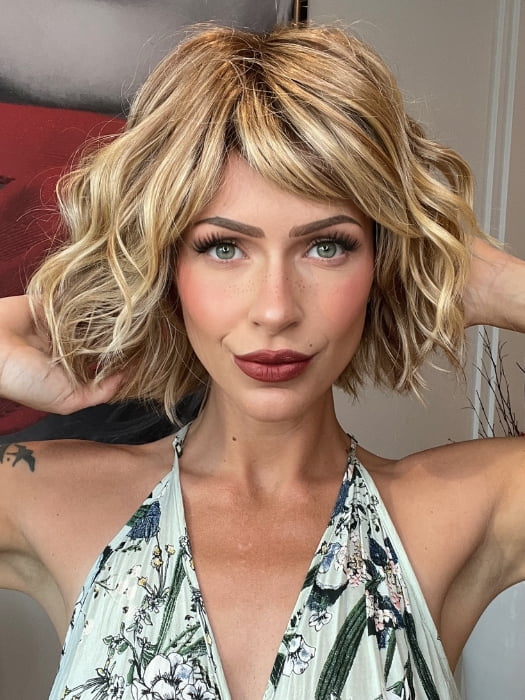 Madeline wearing TREND by TRESSALLURE in 14/26/R10 | Red Blonde with Gold Blonde Highlights and Light Brown Roots