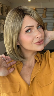 Madeline is wearign ALL THE RAGE by GABOR in GF12-22SS SHADED CAPPUCCINO | Light Golden Brown Evenly Blended with Cool Platinum Blonde Highlights with Dark Roots