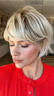 Madeline is wearing TOLEDO by BELLETRESS in CRUSHED ALMOND BLONDE R | A soft Neutral Light Blonde with a Light and Medium Blended Root Color.