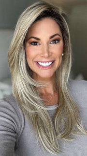 Katy C. @thewigeducator wearing MESMERIZED by RAQUEL WELCH WIGS in color RL19/23SS SHADED BISCUIT | Light Ash Blonde Evenly Blended with Cool Platinum Blonde with Dark Roots | indoor lighting