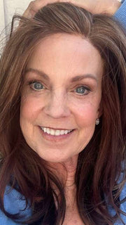 Susan @an_affair_with_hair wearing MIRANDA by JON RENAU in color 32F CHERRY CREME | Medium Red & Medium Red-Gold Blonde Blend with Medium Red Nape | window natural lighting