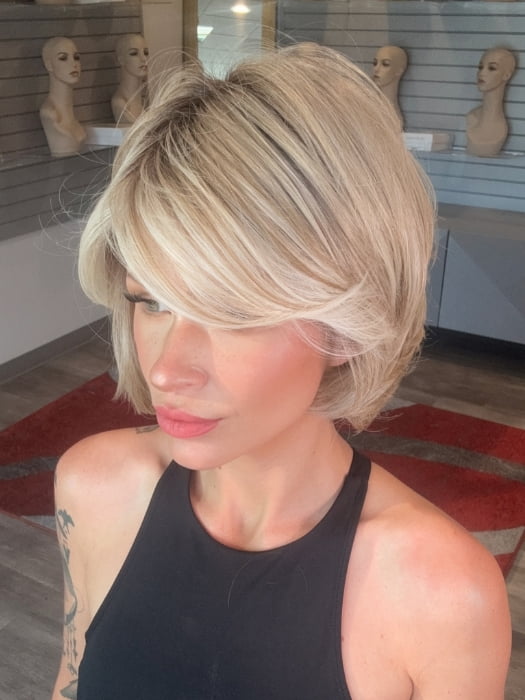 Madeline wearing NAOMI by JON RENAU in 101/88/27S8 CATALINA BLONDE | Pale blonde with Pure White Natural Violet halo highlights, shaded medium brown 
