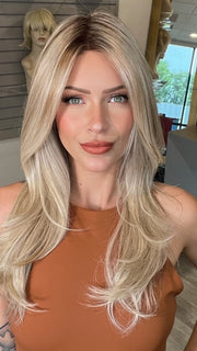 Madeline wearing SPEARS by BELLETRESS in MILKSHAKE BLONDE R | A mixture of Light Sandy Brown, Highlighted with Light Ash Blonde with a Hint of Light Platinum Blonde with a Medium Root Color