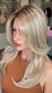 Madeline wearing SPEARS by BELLETRESS in MILKSHAKE BLONDE R | A mixture of Light Sandy Brown, Highlighted with Light Ash Blonde with a Hint of Light Platinum Blonde with a Medium Root Color