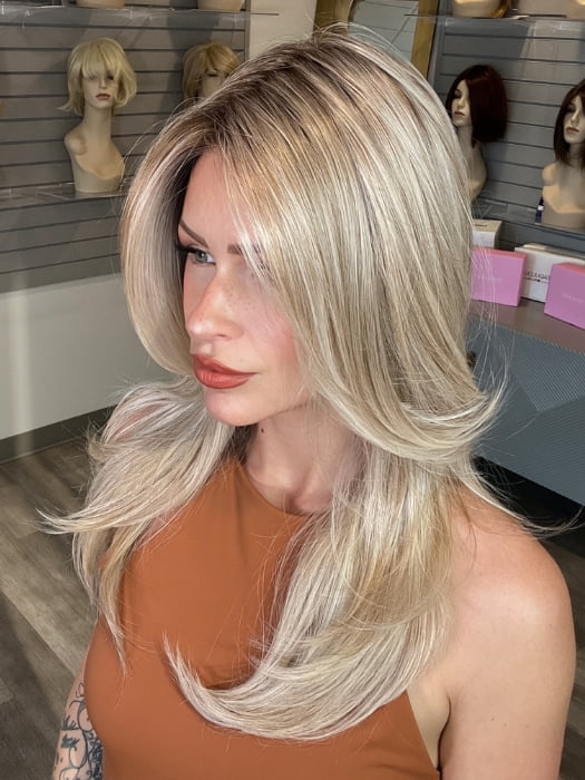 Madeline wearing SPEARS by BELLETRESS in MILKSHAKE BLONDE R | A mixture of Light Sandy Brown, Highlighted with Light Ash Blonde with a Hint of Light Platinum Blonde with a Medium Root Color
