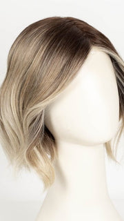 MELTED SAND | Rich, warm brown root melts into the neutral blond tone. Light-beige blond ends complete this stunning color.   