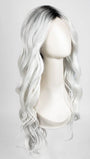 Model is wearing ETHEREAL ICE | Natural dark roots melt into an icy white shade for a beautiful contrast. 