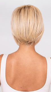 Model is wearing IGNITE by JON RENAU in color FS24/102S12 LAGUNA BLONDE | Light Natural Gold Blonde with Pale Natural Gold Blonde bold highlights, Shaded with Light Gold Brown