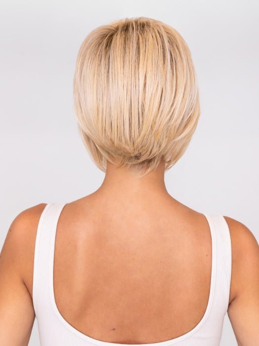 Model is wearing IGNITE by JON RENAU in color FS24/102S12 LAGUNA BLONDE | Light Natural Gold Blonde with Pale Natural Gold Blonde bold highlights, Shaded with Light Gold Brown