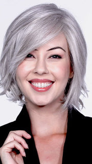 A medium bob with soft curls and subtle layers toward the bottom