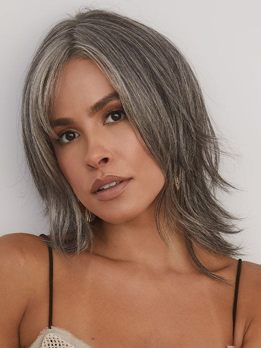 Model is wearing ALICIA by RENE OF PARIS in color MOONLIT SILK | A stunning dark gray tone with a multitude of metallic shades for depth and texture. 