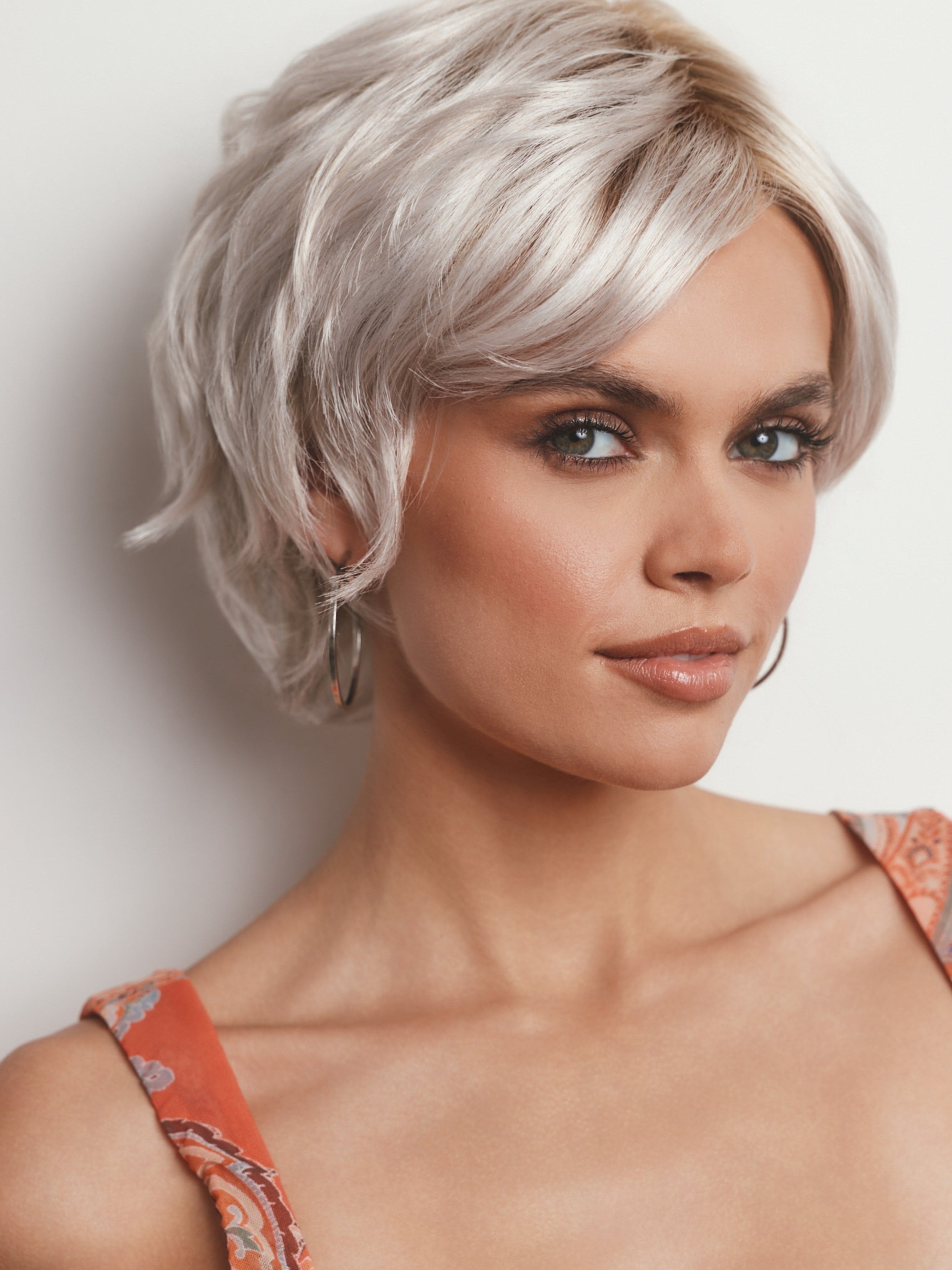 Model is wearing ASHA by RENE OF PARIS in GHOST BLOND R | Rooted Pearl Cream Blond with Platinum Undertones