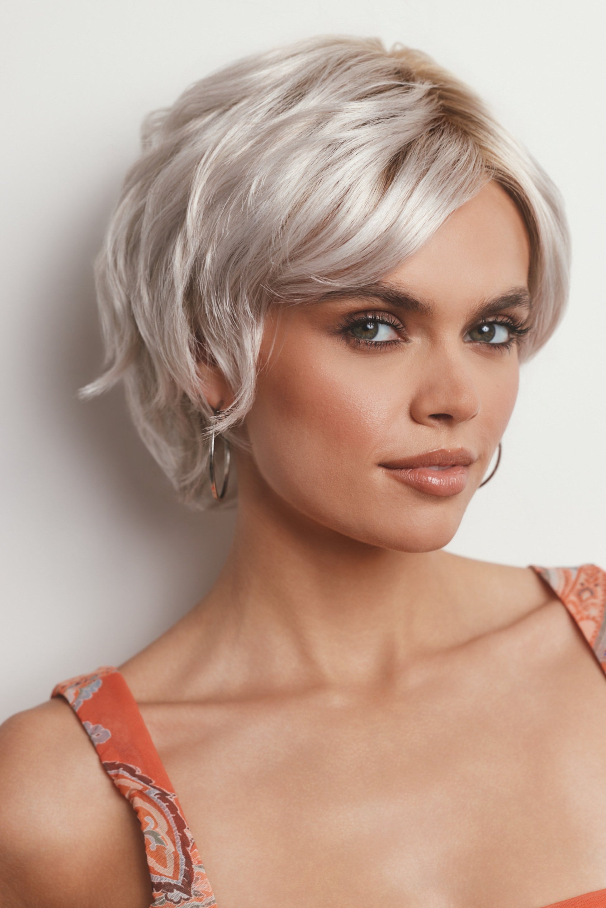 Model is wearing ASHA by RENE OF PARIS in GHOST BLOND R | Rooted Pearl Cream Blond with Platinum Undertones
