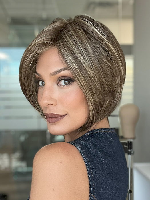 Model is wearing AVA by JON RENAU in color 10RH16 CAFFE MOCHA | Light Brown with 33% Light Natural Blonde Highlights