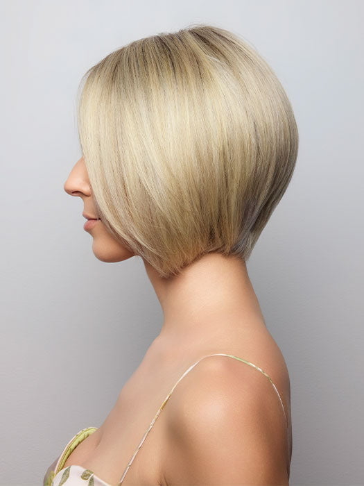 Model is wearing AYUMI by NORIKO in color Light Ash Blond R | Cream Ash Blonde with ash brown and white-grey roots that blend into a variety of ash blonde tones, including ash pearl blonde, creamy ivory, and pale cream
