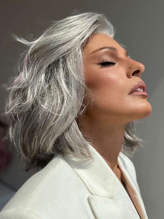 Model is wearing SAGE by ESTETICA in color R51LF60 | Off Black with 75% Grey Lightening to Gold Blonde Mix in Front