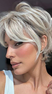 Model is wearing CURATED CUT by RAQUEL WELCH in color RL19/23SS SHADED BISCUIT | Light Ash Blonde Evenly Blended with Cool Platinum Blonde with Dark Roots