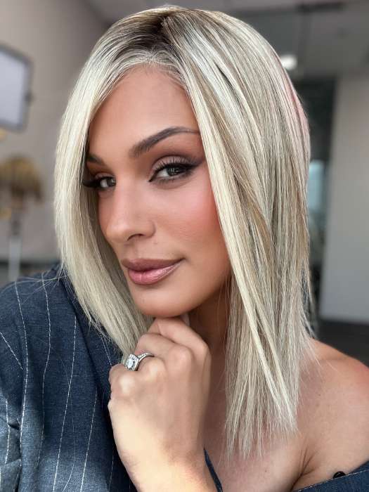 Model is wearing CARRIE LARGE by JON RENAU in color 101/88/27S8 CATALINA BLONDE | Pale blonde with Pure White Natural Violet halo highlights, shaded medium brown