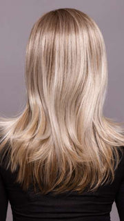 Model is wearing SAVELLI by ELLEN WILLE in color IVORY BLONDE TIPPED 101.15.12 | Dark Neutral Blonde with Pearl Platinum and Pearl White Blend with Lighter Tipped Ends