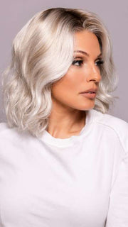 Model is wearing MILA by ELLEN WILLE in shade ICE BLONDE LIGHTED 60.1001.101 | Pearl White, Winter White, and Pearl Platinum Blend with Highlights throughout and Concentrated in the front