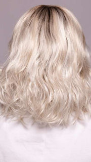 Model is wearing MILA by ELLEN WILLE in shade ICE BLONDE LIGHTED 60.1001.101 | Pearl White, Winter White, and Pearl Platinum Blend with Highlights throughout and Concentrated in the front