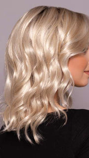 Model is wearing AERI by ESTETICA in color SUNLIT-BLONDE | Soft Blend of Sandy Blonde, Lightest Blonde and Iced Blonde with a Light Golden Brown Root