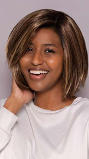 Model is wearing LUMI by ESTETICA in color CKISSRT4 | Golden Brown with Copper Blonde Highlights and Dark Brown Roots