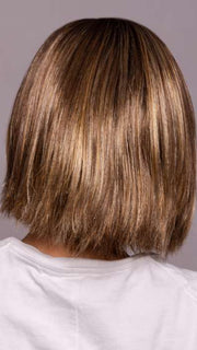 Model is wearing LUMI by ESTETICA in color CKISSRT4 | Golden Brown with Copper Blonde Highlights and Dark Brown Roots