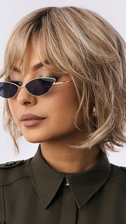 Model is wearing BRANN in SANDY BEIGE BLONDE R | Carefully placed shades of dark sandy blonde and light neutral blonde with medium root tone for added depth.         