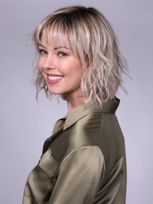 Model is wearing BROADWAY By BELLETRESS in CRUSHED-ALMOND-BLONDE-R | A Soft Neutral Light Blonde with a Light and Medium Blended Root Color