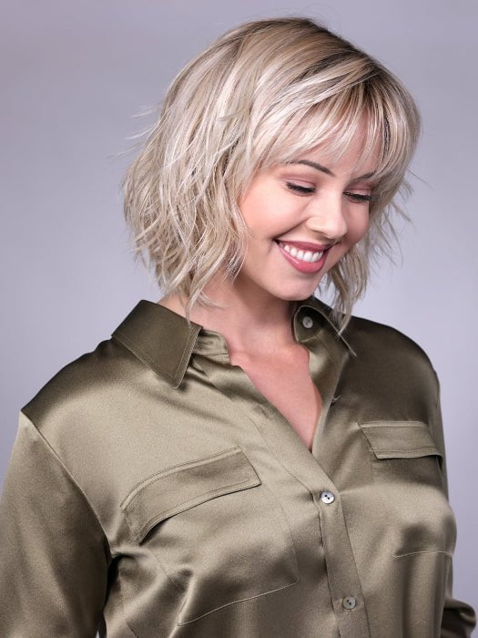 Model is wearing BROADWAY By BELLETRESS in CRUSHED-ALMOND-BLONDE-R | A Soft Neutral Light Blonde with a Light and Medium Blended Root Color