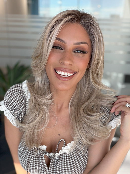 Roxie wearing BROOKLYN by BELLE TRESS in color MILKSHAKE BLONDE R | Mixture of Light sandy brown, highlighted with light ash blonde with a hint of light platinum blonde with medium root color.