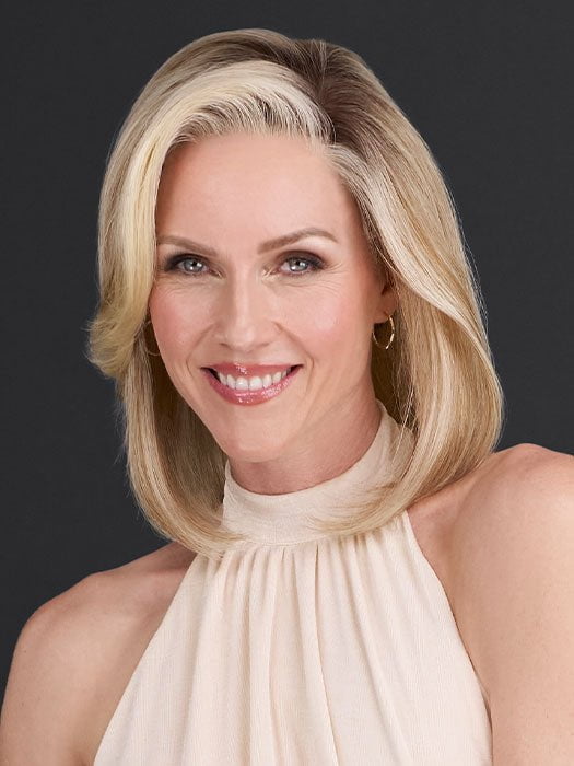 Model is wearing CARRIE by JON RENAU in color 101/88/27S8 CATALINA BLONDE | Pale blonde with Pure White Natural Violet halo highlights, shaded medium brown