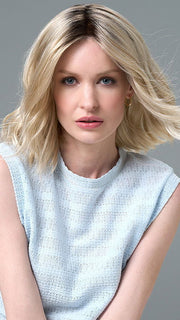 Model is wearing Charlotte Large by ENVY in color SILKY BEIGE |  Light Platinum Blonde with Dark Brown Roots