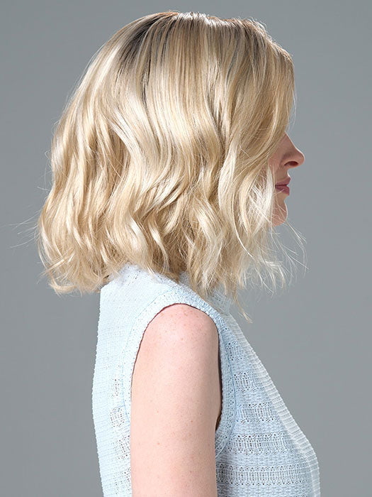 Model is wearing Charlotte Large by ENVY in color SILKY BEIGE |  Light Platinum Blonde with Dark Brown Roots