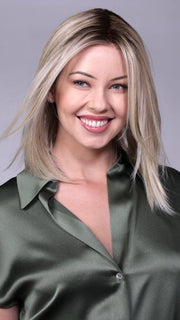 Model is wearing CHELSEA by BELLETRESS in CRUSHED-ALMOND-BLONDE-R | A soft Neutral Light Blonde with a Light and Medium Blended Root Color