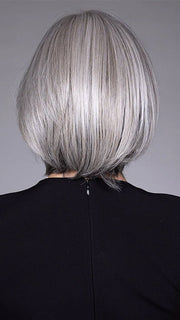 Model is wearing DION in color COCANUT MILK GREY R | Creamy, off-white tones with soft gray hues, creating a pearlescent or silvery finish.