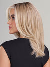 Model is wearing DREW by JON RENAU in color 101/88/27S8 CATALINA BLONDE | Pale blonde with Pure White Natural Violet halo highlights, shaded medium brown