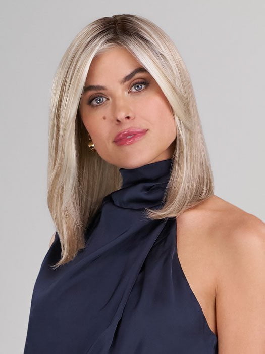 Model is wearing ELLE by JON RENAU in color 101/88/27S8 CATALINA BLONDE | Pale blonde with Pure White Natural Violet halo highlights, shaded medium brown
