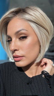 Roxie wearing STRAIGHT UP WITH A TWIST By RAQUEL WELCH in RL19/23SS SHADED BISCUIT | Cool Platinum blonde with subtle highlights and medium brown roots